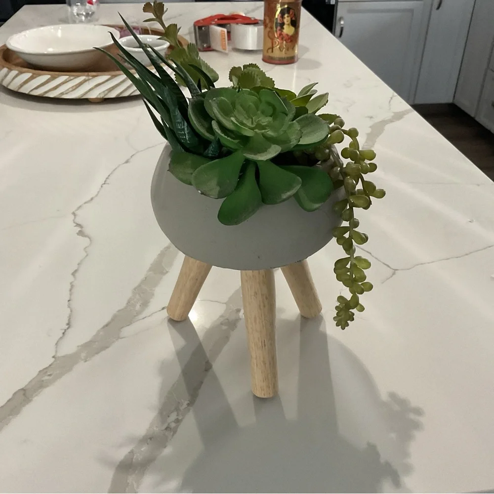 Chic Gray Planter with Wooden Legs and Lush Green Faux Succulents